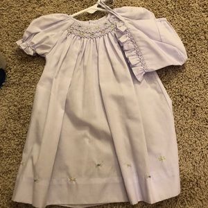 Hand embroidered dress with matching bonnet.